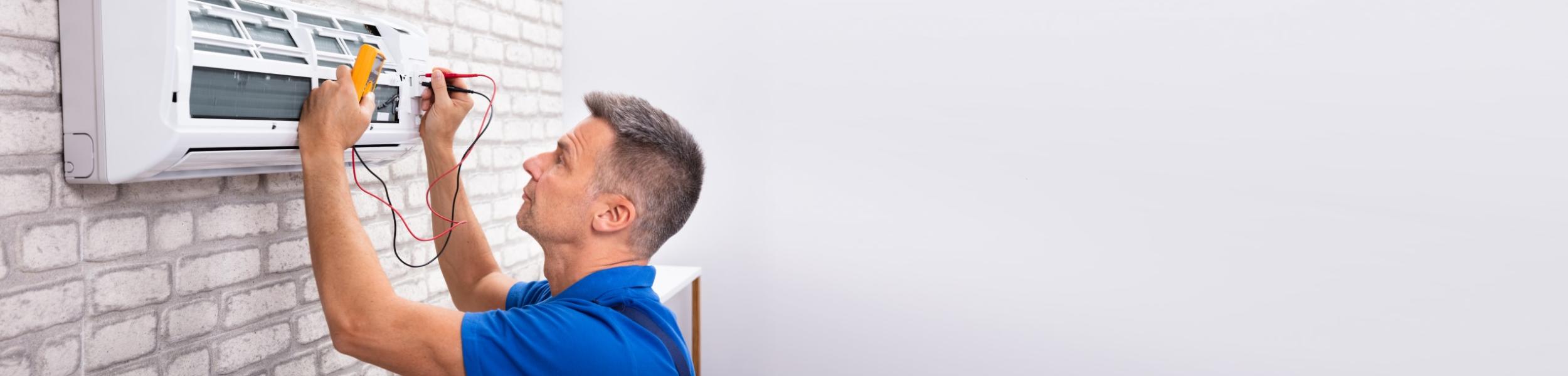 image of an air conditioning repair person repairing an AC unit